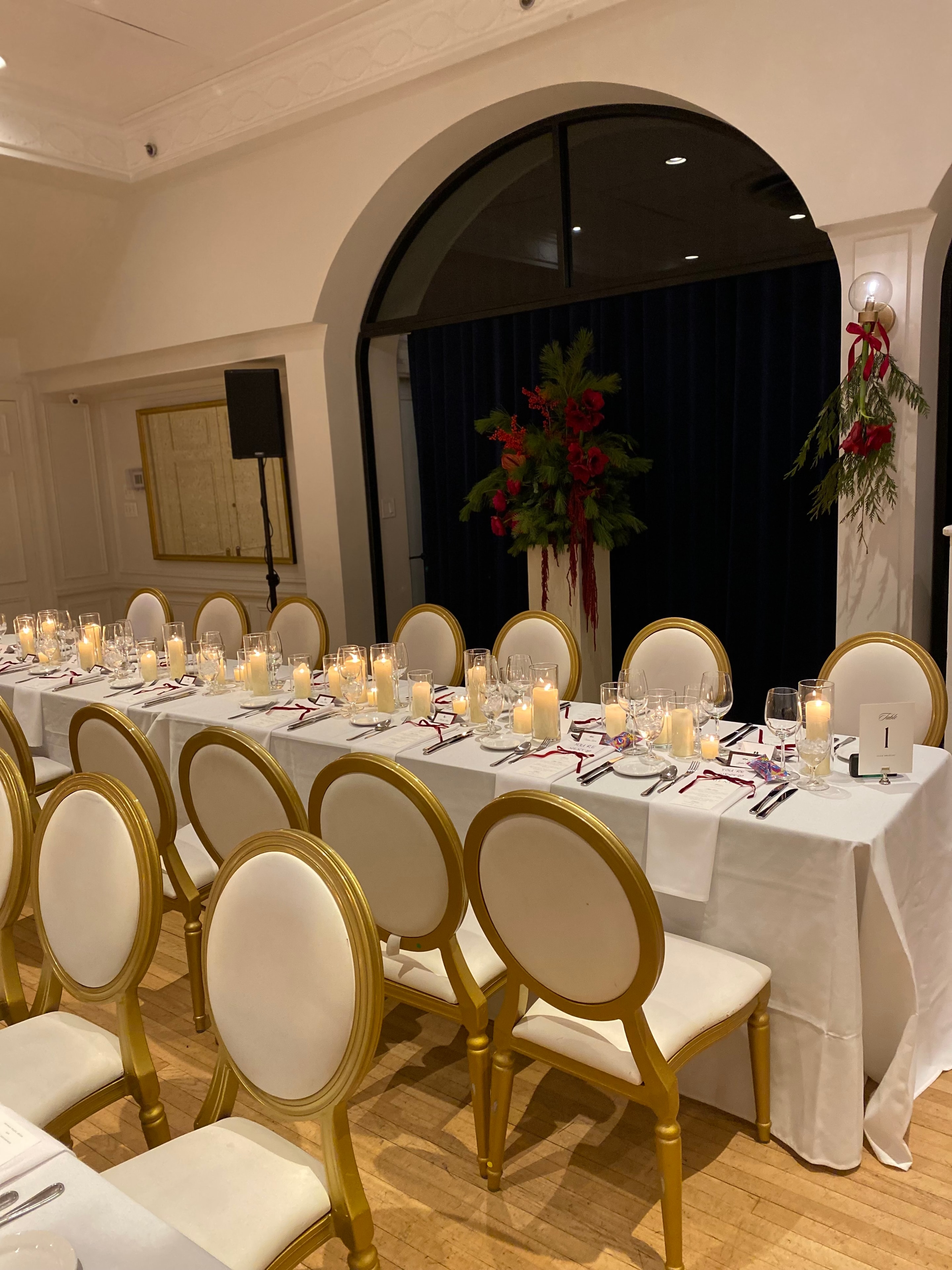 Wedding planning details arranged on a candlelit reception table